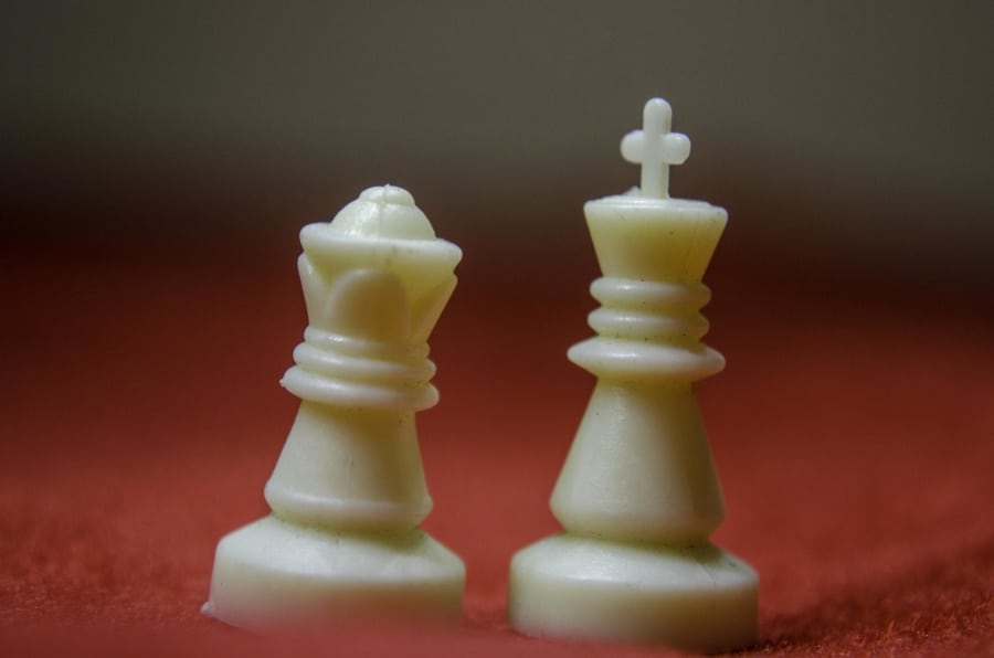 Why are the king and queen opposite in chess?