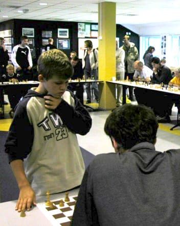 Who become chess master at the age of 12?